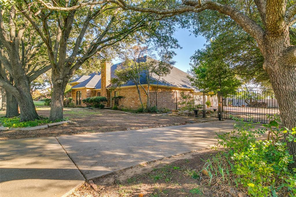 1920 Pearson Crossing Keller, TX 76248 - Photo 2 of 25 a view of street with large trees