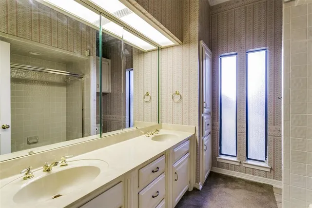 a view of a house with a wooden fence