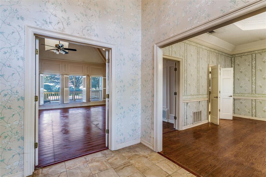 1920 Pearson Crossing Keller, TX 76248 - Photo 6 of 25 a view of a hallway with wooden floors and cabinet