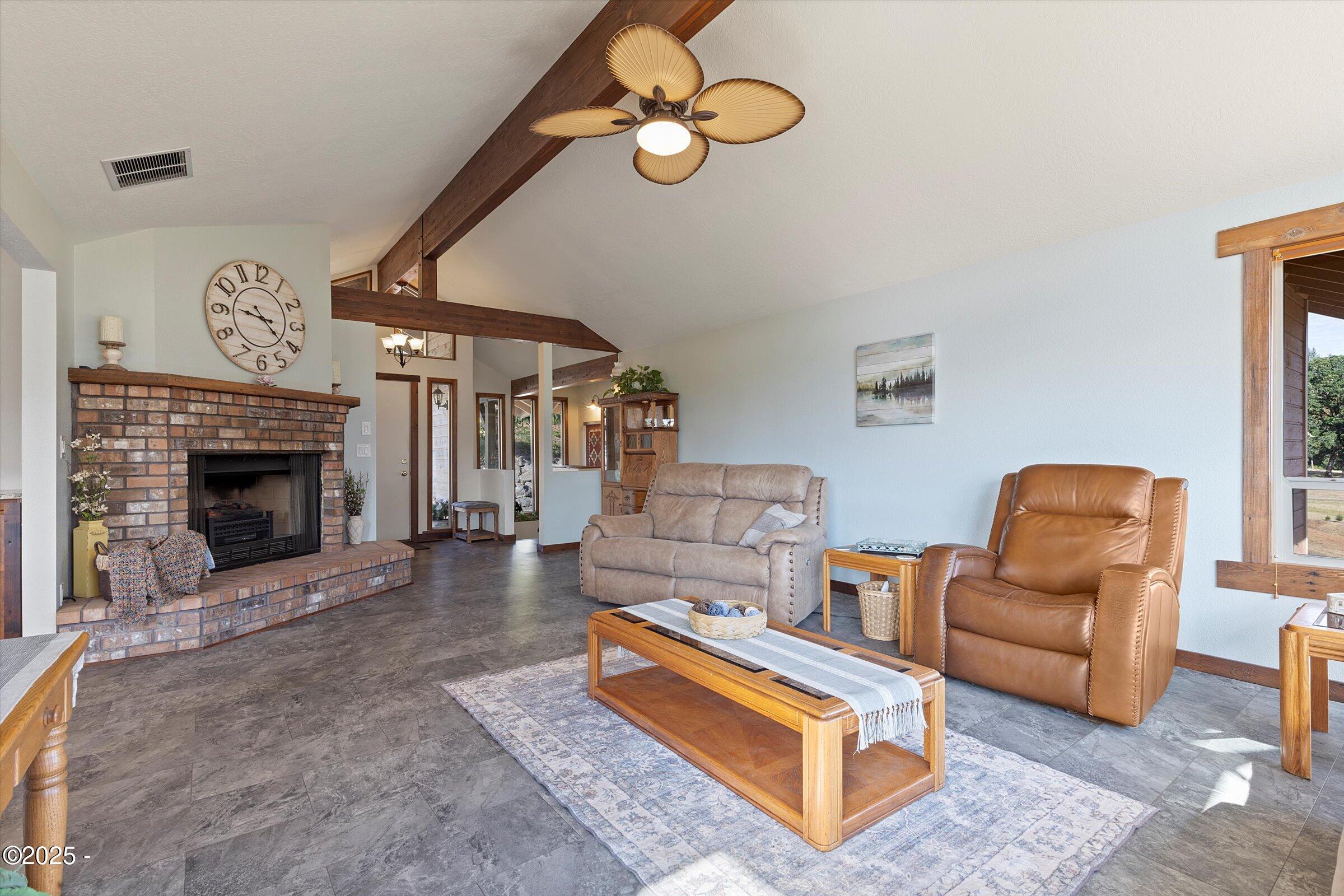 21560 Gooseneck Road Sheridan, OR 97378 - Photo 17 of 63 a living room with furniture and a fireplace