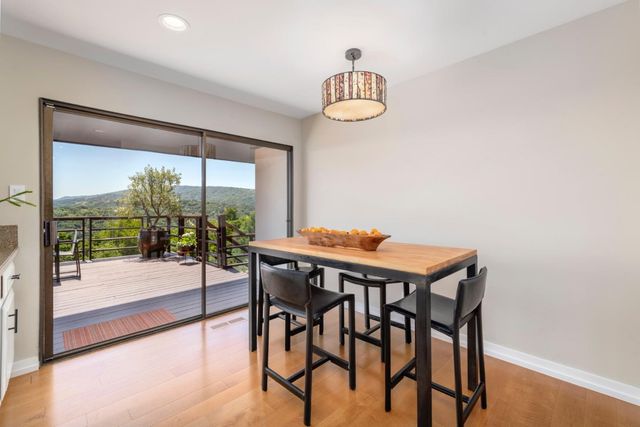 a building outdoor space with patio furniture and potted plants