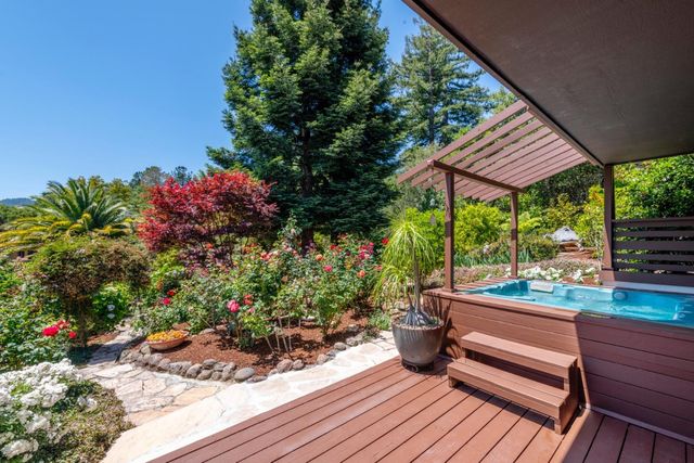 a view of a chairs and table in a backyard