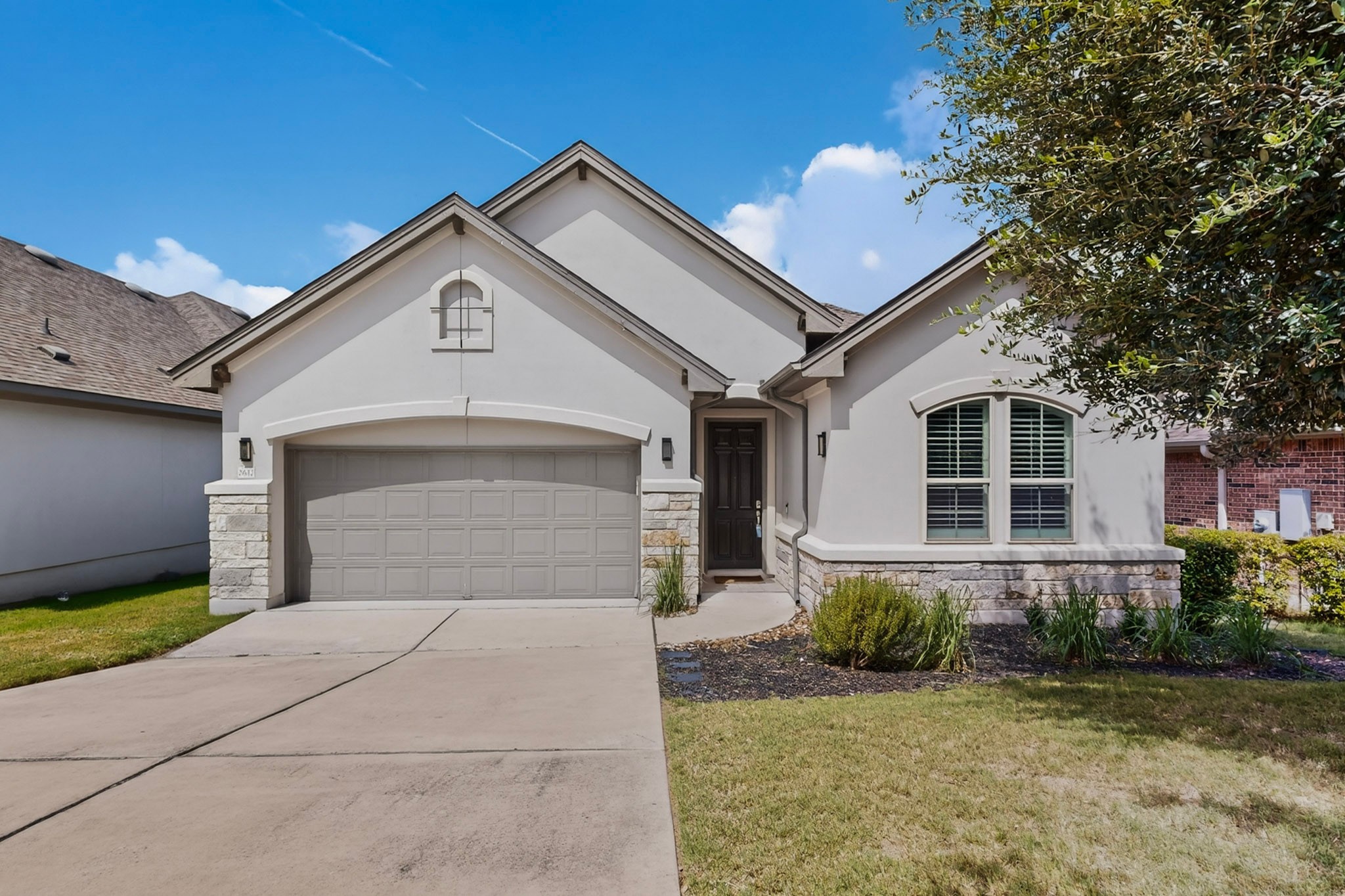 2617 Milan Meadows Drive Leander, TX 78641 - Photo 38 of 40 Modern facade with clean lines and a stone accent foundation invites you home.