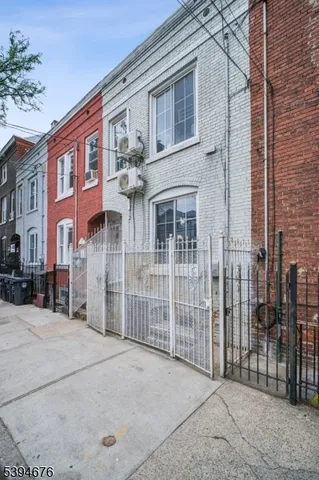 a view of a brick building with many windows