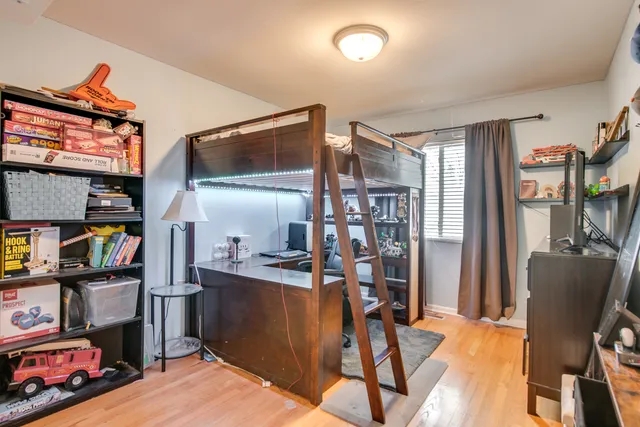 a view of a workspace with furniture and a flat screen tv