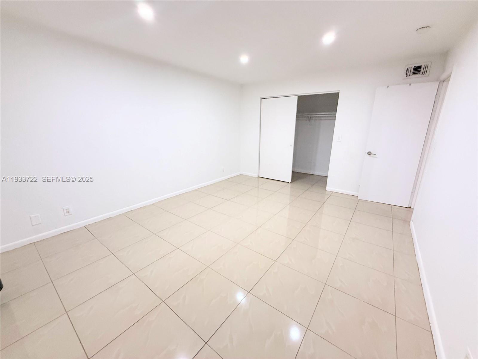 2950 Griffin Road, Unit 3 Dania Beach, FL 33312 - Photo 3 of 13 an empty room with white walls