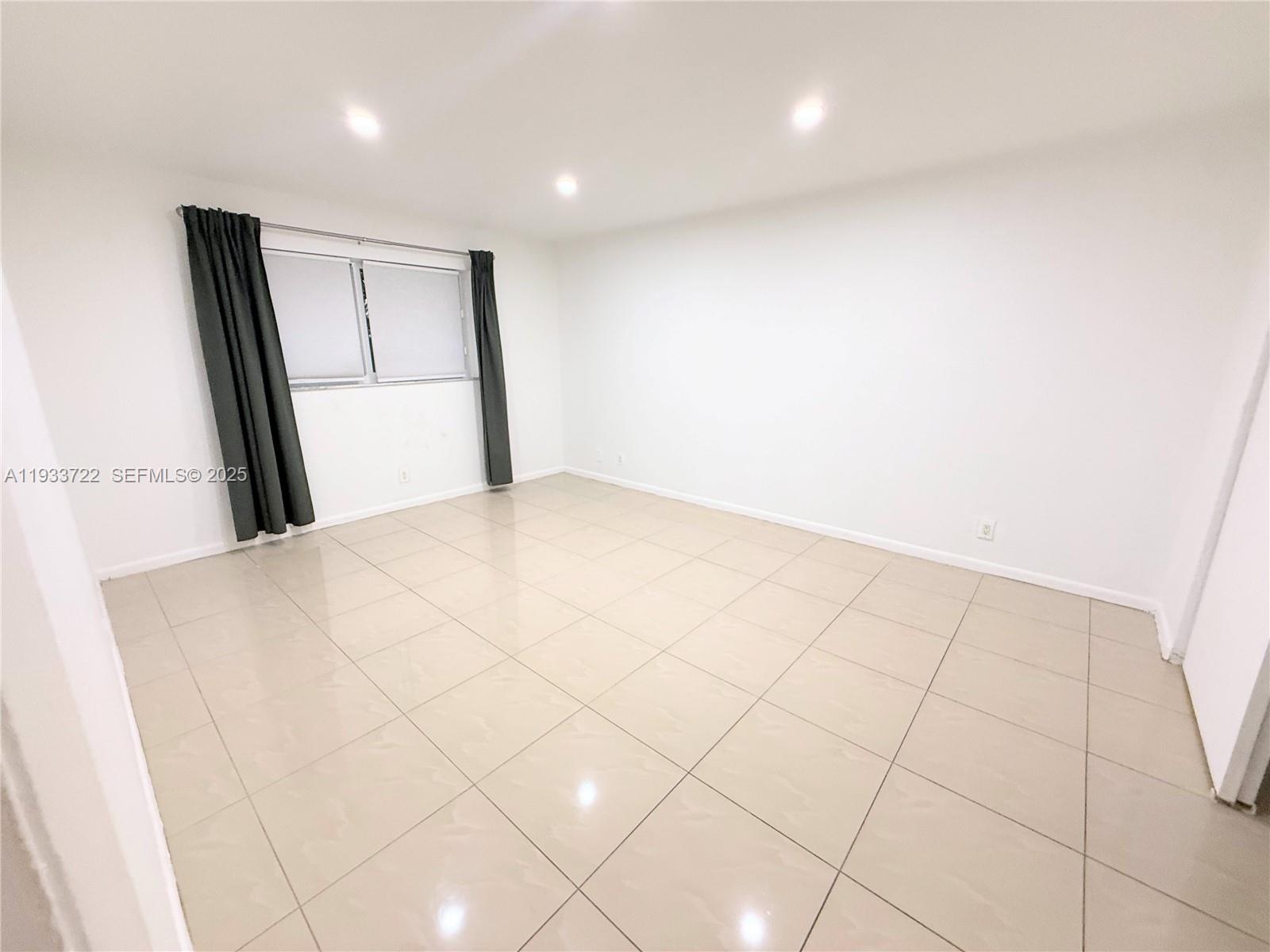 2950 Griffin Road, Unit 3 Dania Beach, FL 33312 - Photo 6 of 13 a view of an empty room and a window