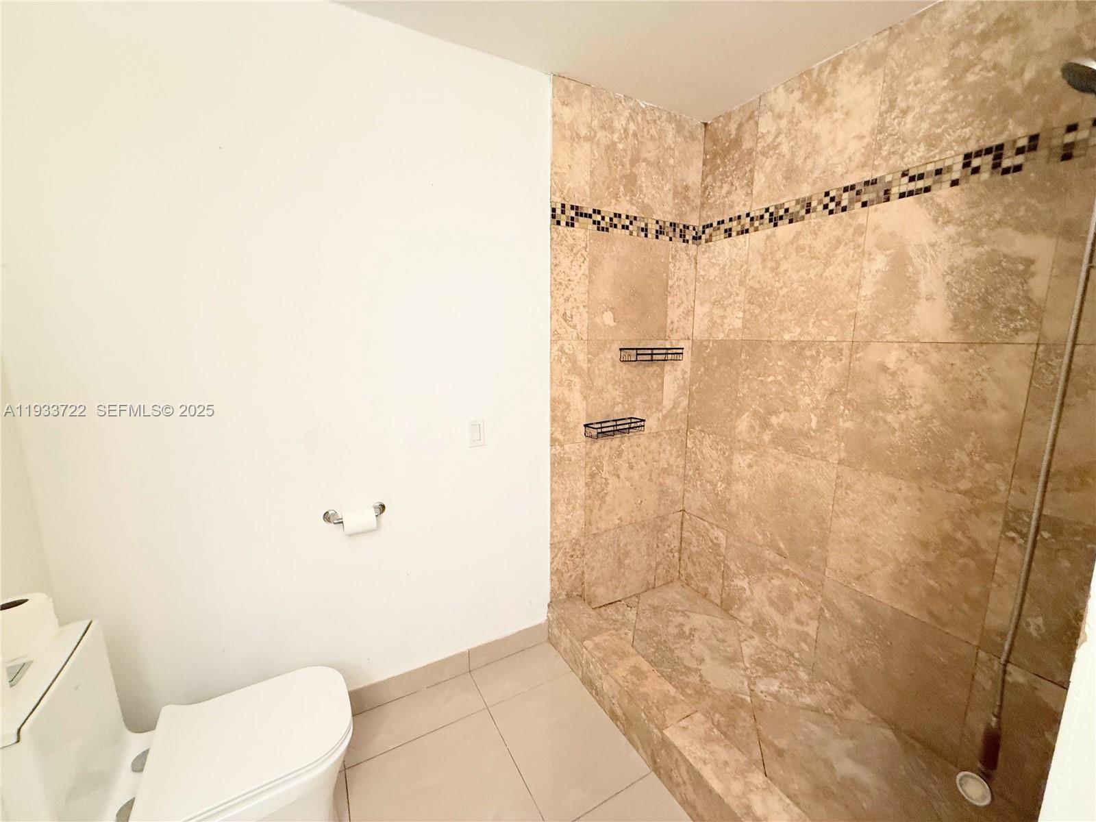 2950 Griffin Road, Unit 3 Dania Beach, FL 33312 - Photo 8 of 13 a bathroom with a toilet and a shower
