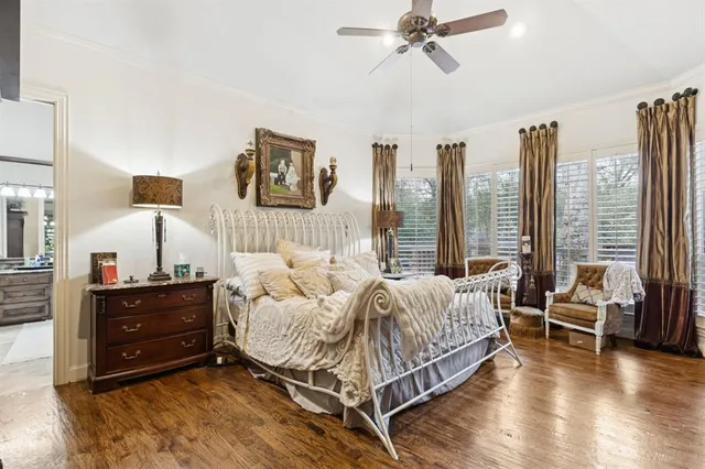 a spacious bedroom with a bed and window