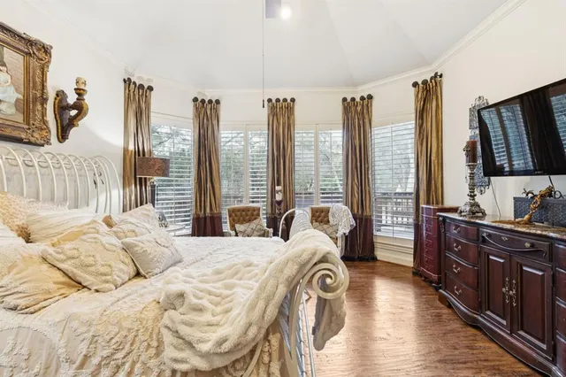 a bed room with a bed and a television