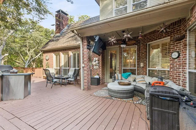 a view of a patio with table and chairs and potted plants