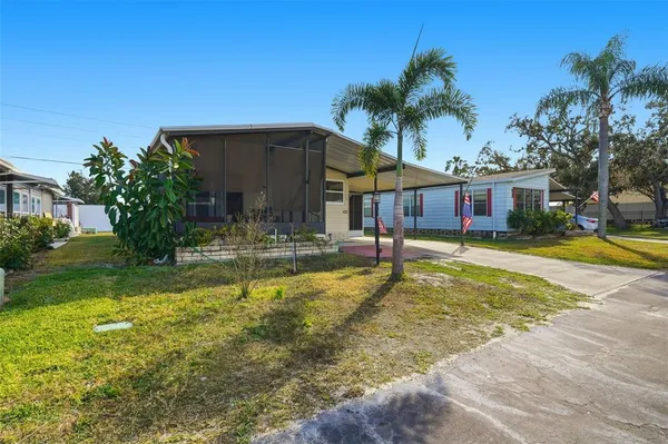 a house with swimming pool in front of it