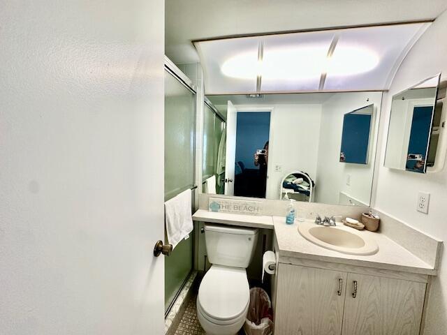 4091 Cornwall East, Unit 4091 Boca Raton, FL 33434 - Photo 11 of 27 a bathroom with a toilet sink and mirror
