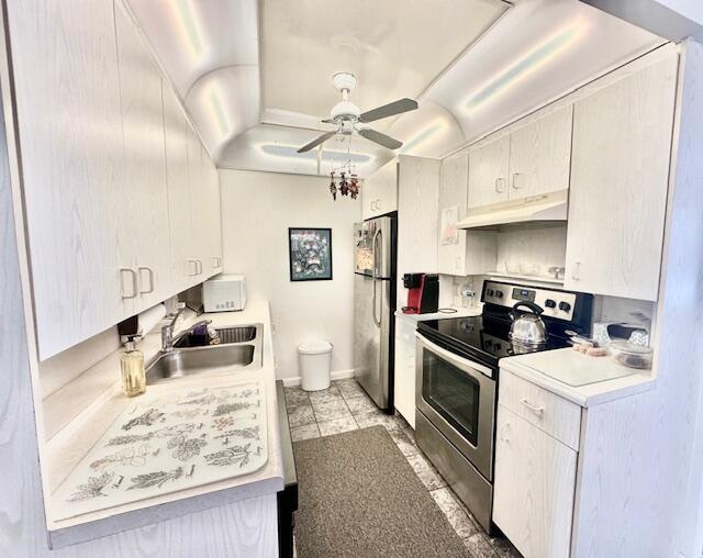 4091 Cornwall East, Unit 4091 Boca Raton, FL 33434 - Photo 3 of 27 a kitchen with stainless steel appliances granite countertop a sink stove and refrigerator