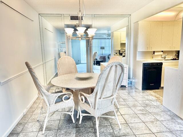 4091 Cornwall East, Unit 4091 Boca Raton, FL 33434 - Photo 6 of 27 a view of a dining room with furniture and chandelier