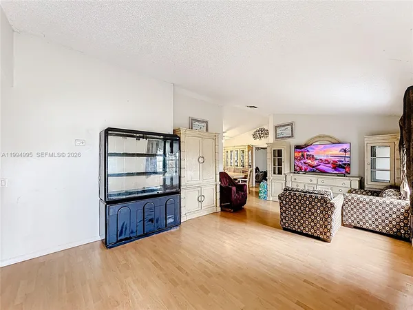 a view of living room filled with furniture and window