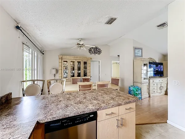 a view of living room with granite countertop furniture and fireplace
