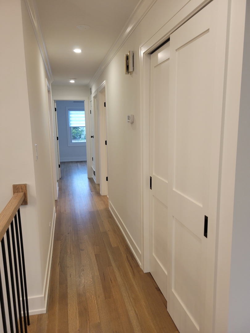 2S245 Mayfield Lane Glen Ellyn, IL 60137 - Photo 12 of 26 a view of a hallway with wooden floor