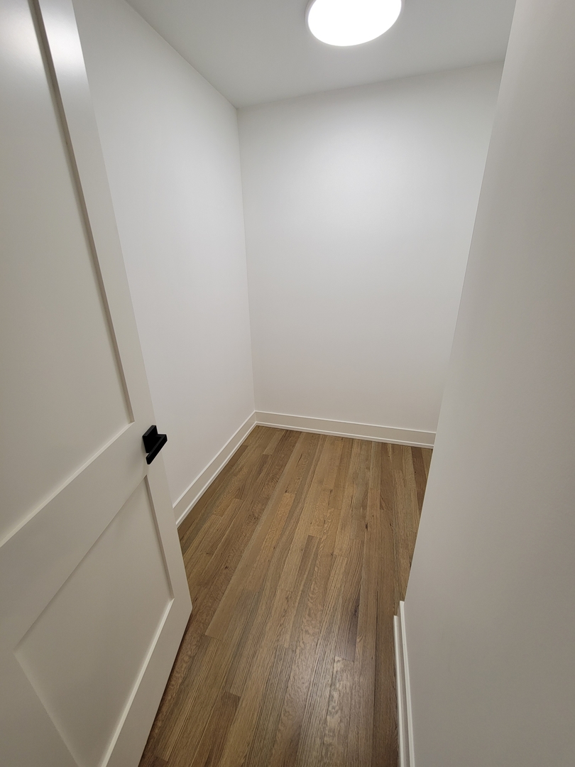 2S245 Mayfield Lane Glen Ellyn, IL 60137 - Photo 16 of 26 a view of a room with wooden floor