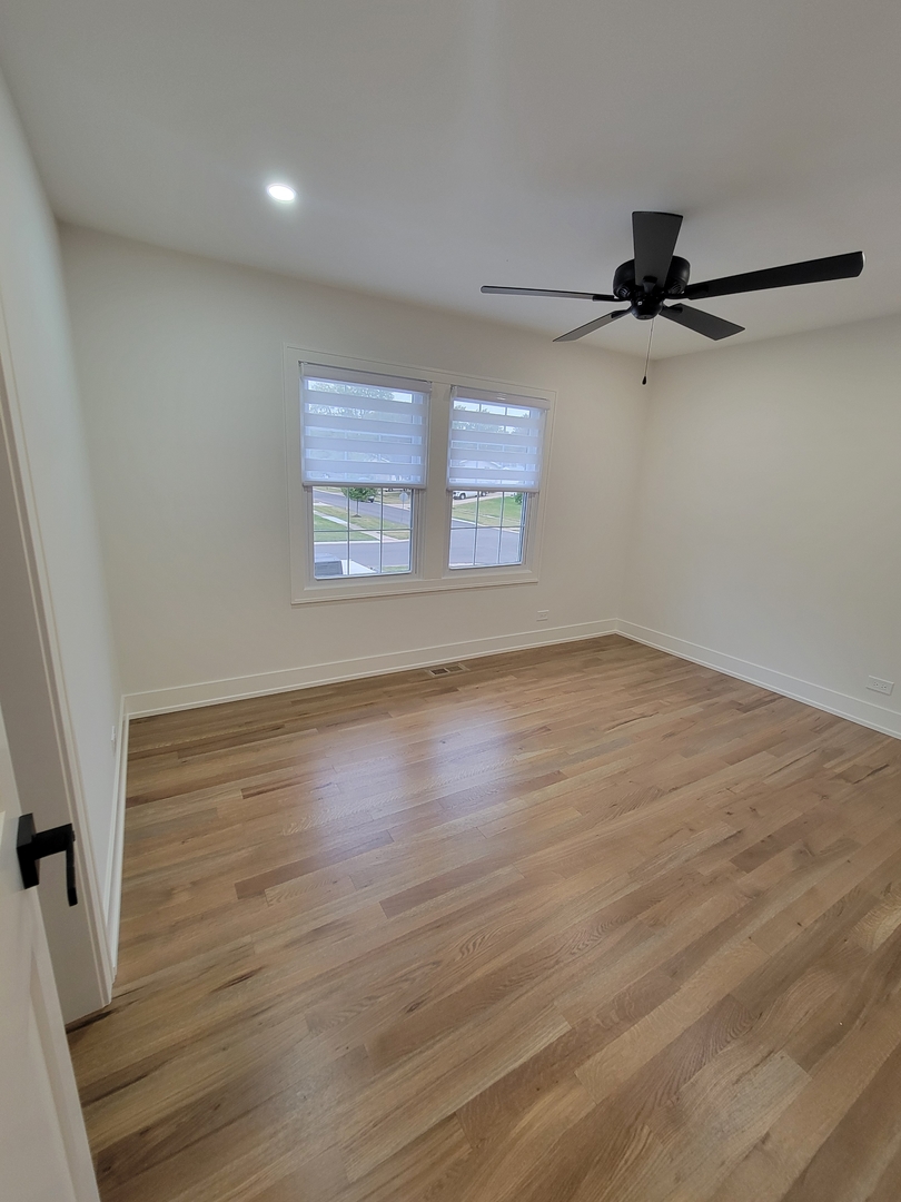 2S245 Mayfield Lane Glen Ellyn, IL 60137 - Photo 18 of 26 wooden floor in an empty room with a window