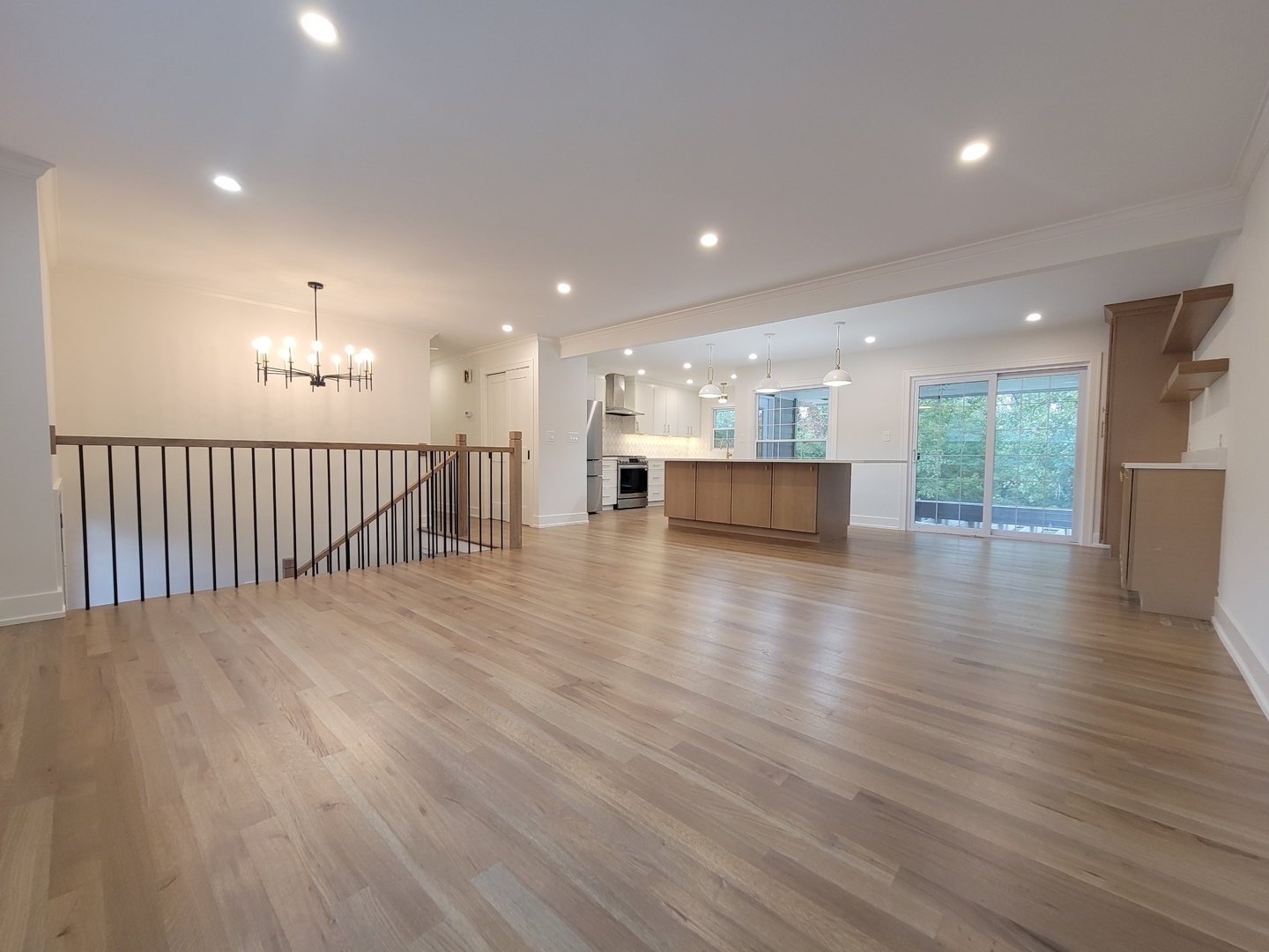 2S245 Mayfield Lane Glen Ellyn, IL 60137 - Photo 6 of 26 a view of a big room with wooden floor and windows