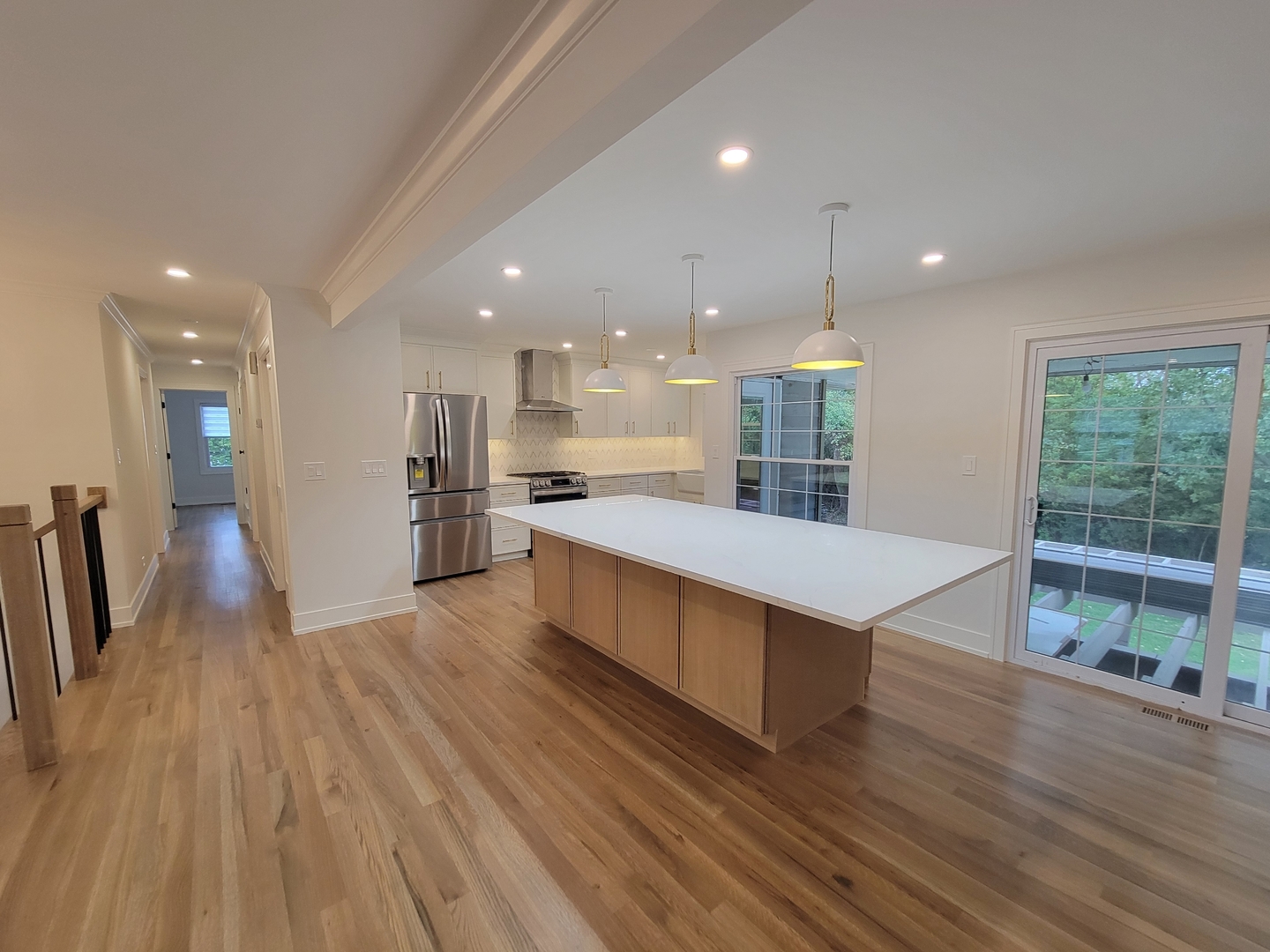 2S245 Mayfield Lane Glen Ellyn, IL 60137 - Photo 9 of 26 a large kitchen with stainless steel appliances a large counter top a wooden floors and a large window