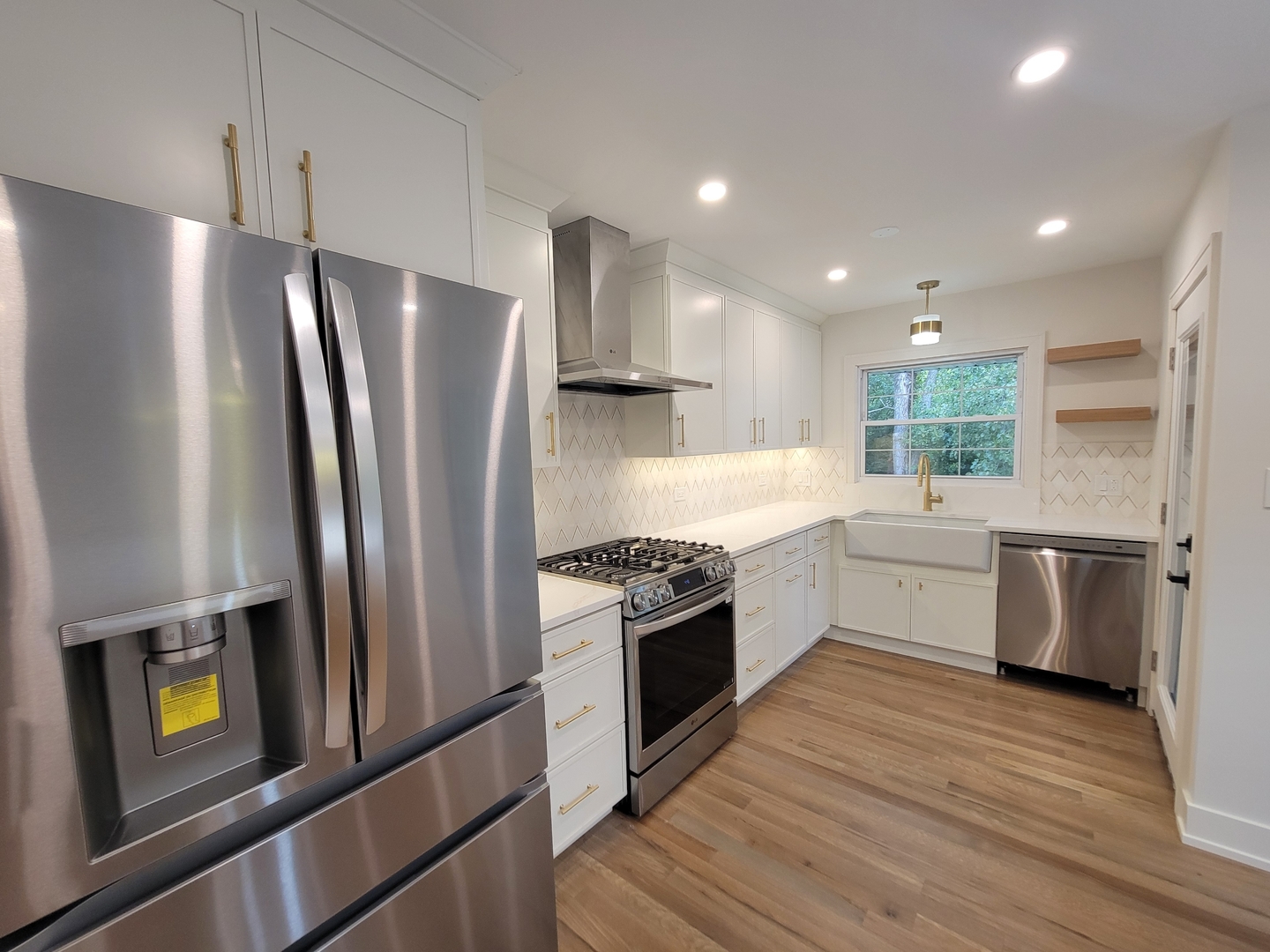 2S245 Mayfield Lane Glen Ellyn, IL 60137 - Photo 10 of 26 a kitchen with stainless steel appliances granite countertop a refrigerator a stove and a wooden floors