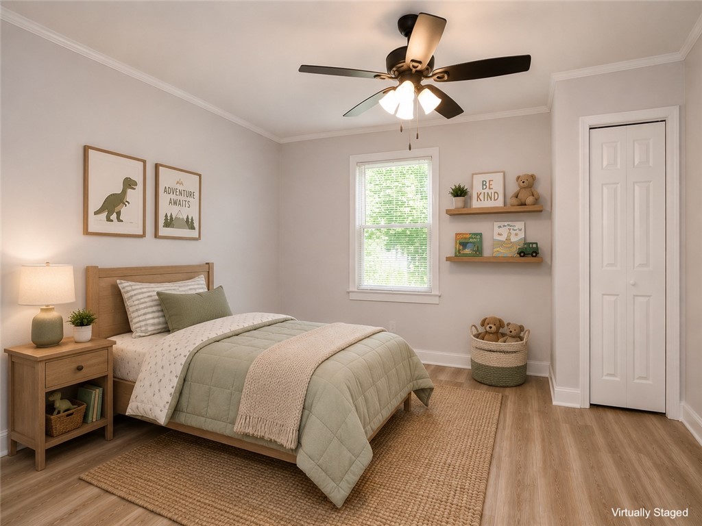 3517 Shawnee Avenue Anderson, SC 29626 - Photo 7 of 25 An inviting bedroom with light wood flooring provides a serene space for rest and relaxation.