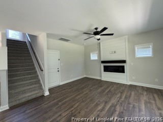 390 Summerhill Road Fayetteville, NC 28303 - Photo 4 of 27 a view of a livingroom with wooden floor and a ceiling fan
