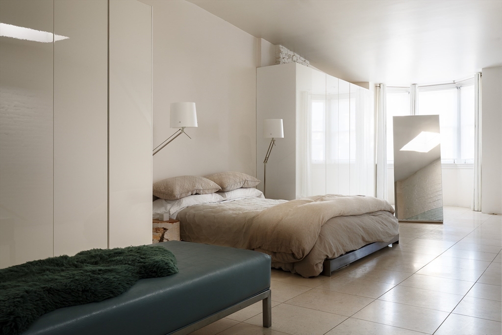 80 Appleton Street Boston, MA 02116 - Photo 15 of 30 a bedroom with a bed and a window