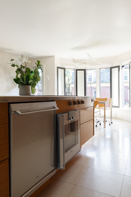 80 Appleton Street Boston, MA 02116 - Photo 9 of 30 a kitchen with stainless steel appliances granite countertop a refrigerator and a sink