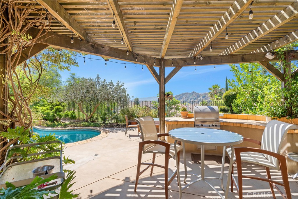 25730 Hawthorne Place Stevenson Ranch, CA 91381 - Photo 33 of 41 Pergola with lights and built-in barbecue