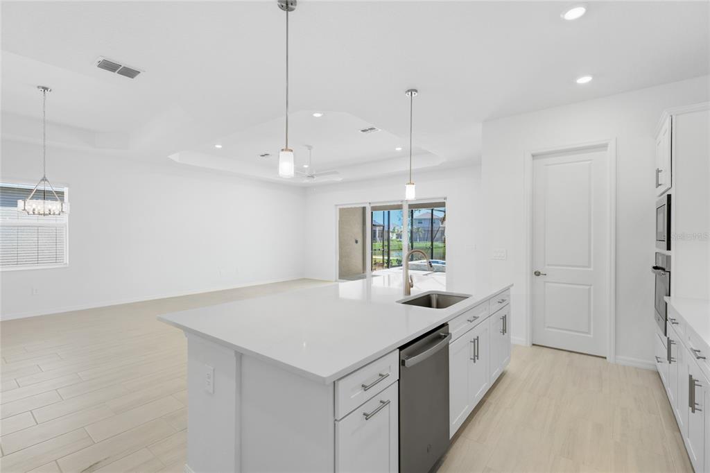 19156 Cherrystone Way Lakewood Ranch, FL 34211 - Photo 13 of 49 a kitchen with a sink a counter top space and a window
