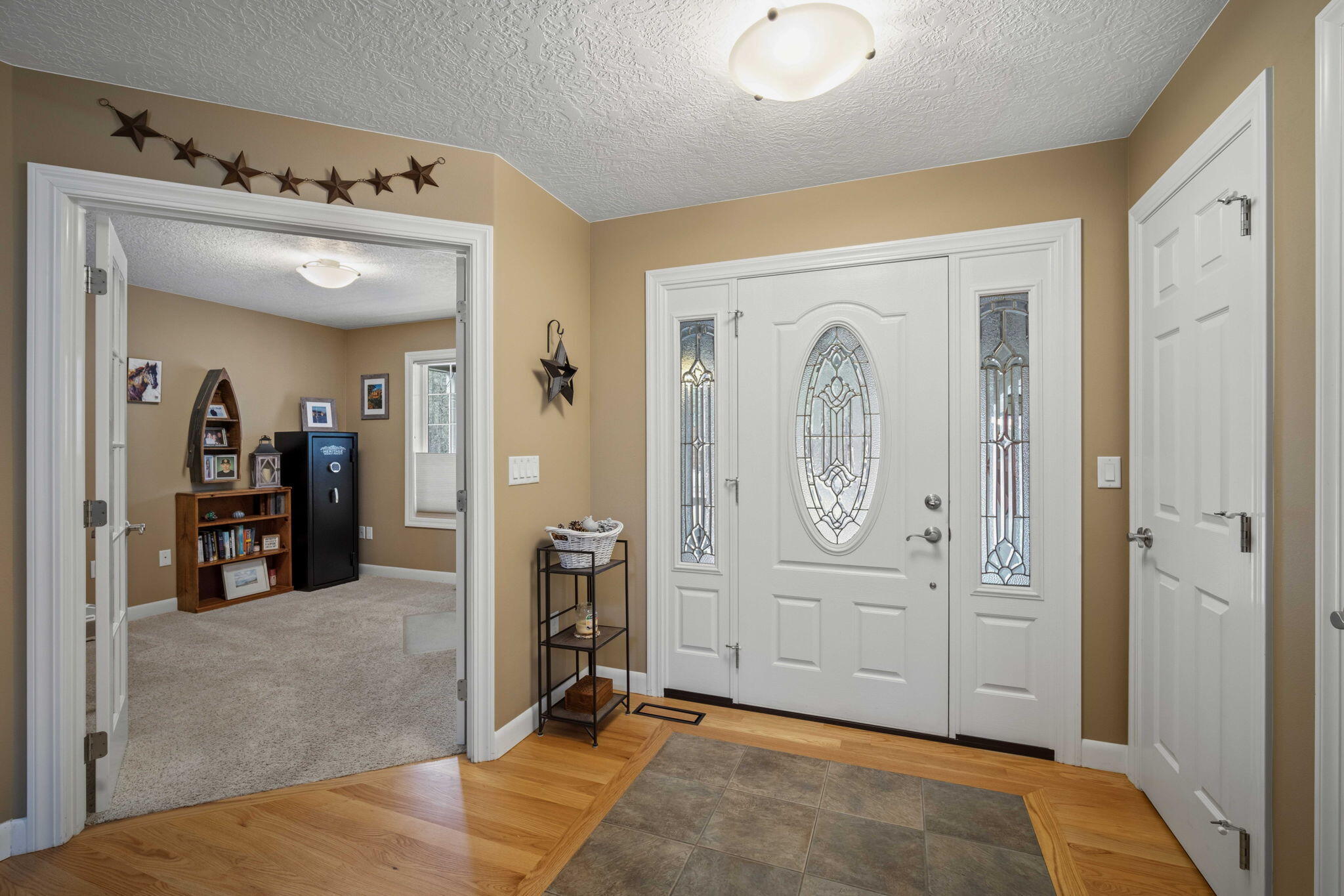 14234 Whitewater Loop La Pine, OR 97739 - Photo 7 of 62 Tile inset entry way. Office to the left and coat closet to the right.