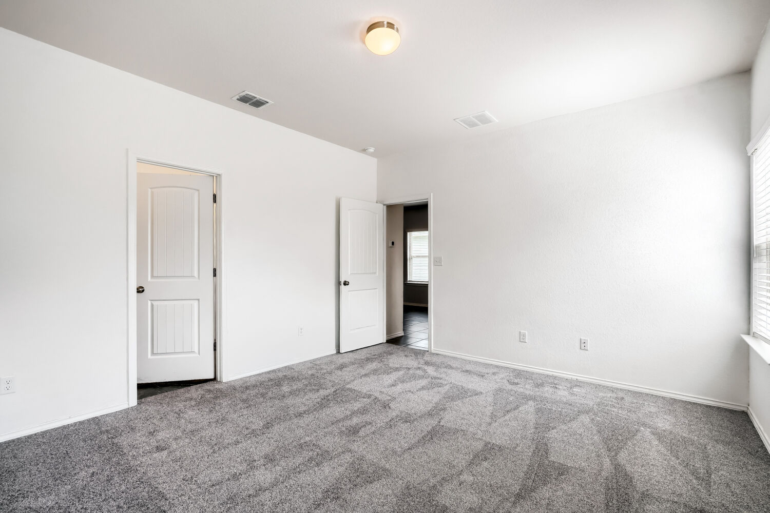 2420 Ranger Pass Seguin, TX 78155 - Photo 13 of 28 Carpeted room featuring white walls, white trim, and two paneled interior doors