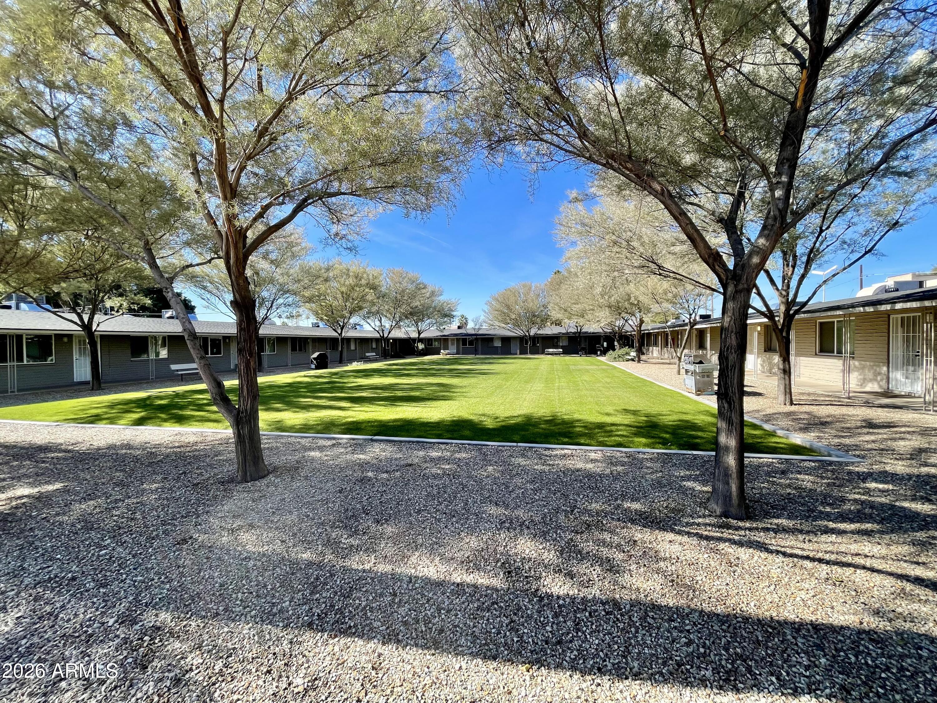 6819 North 12th Street, Unit 9 Phoenix, AZ 85014 - Photo 17 of 21 a view of a house with a yard