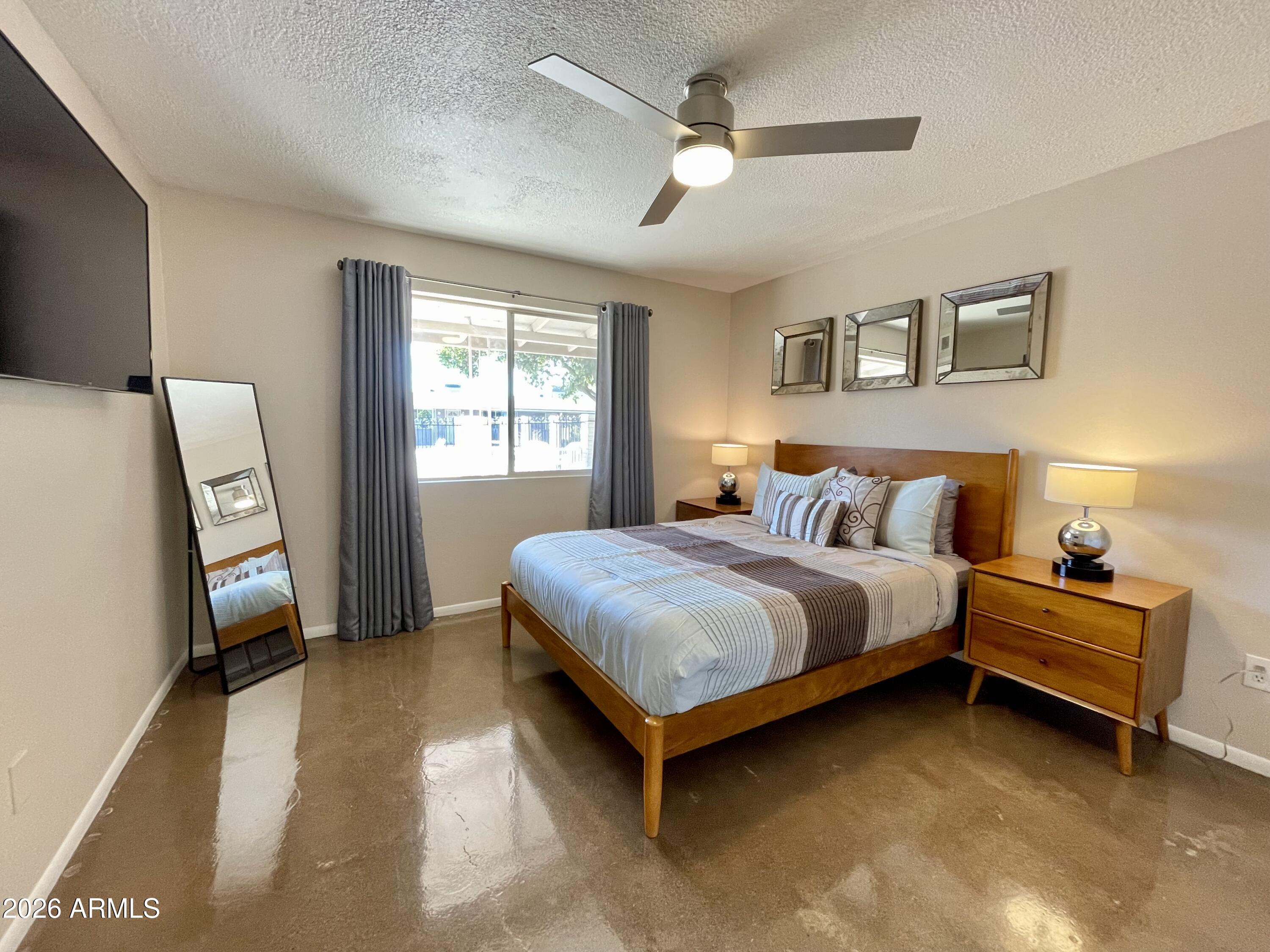 6819 North 12th Street, Unit 9 Phoenix, AZ 85014 - Photo 10 of 21 a bedroom with bed and window