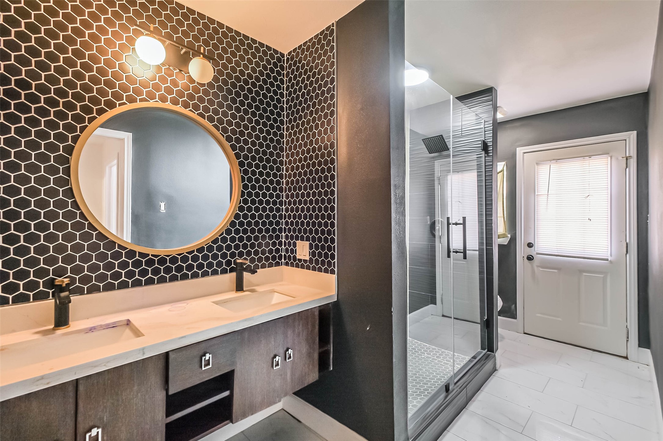 11019 Clodine Road Sugar Land, TX 77498 - Photo 23 of 39 a bathroom with a sink mirror vanity and shower