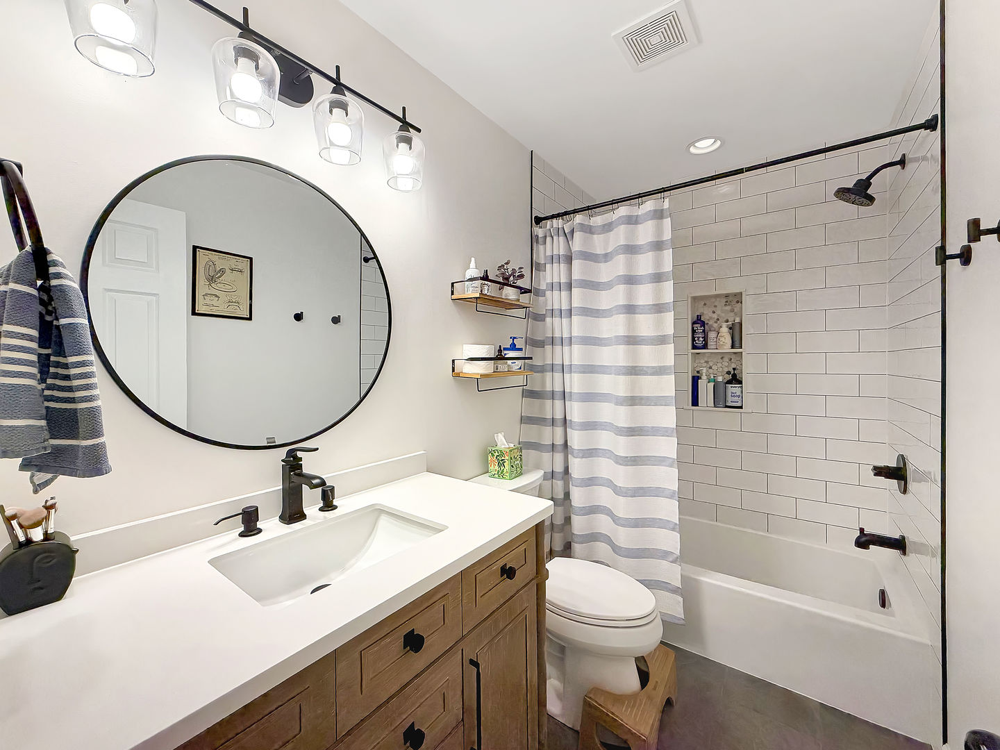 104 McClellan Street Bartlett, IL 60103 - Photo 11 of 21 a bathroom with a sink a toilet and a mirror