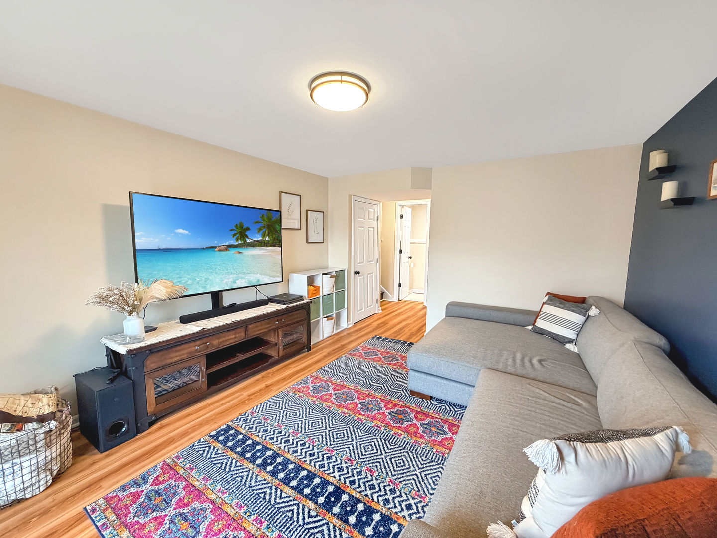 104 McClellan Street Bartlett, IL 60103 - Photo 17 of 21 a living room with a bed and a flat screen tv