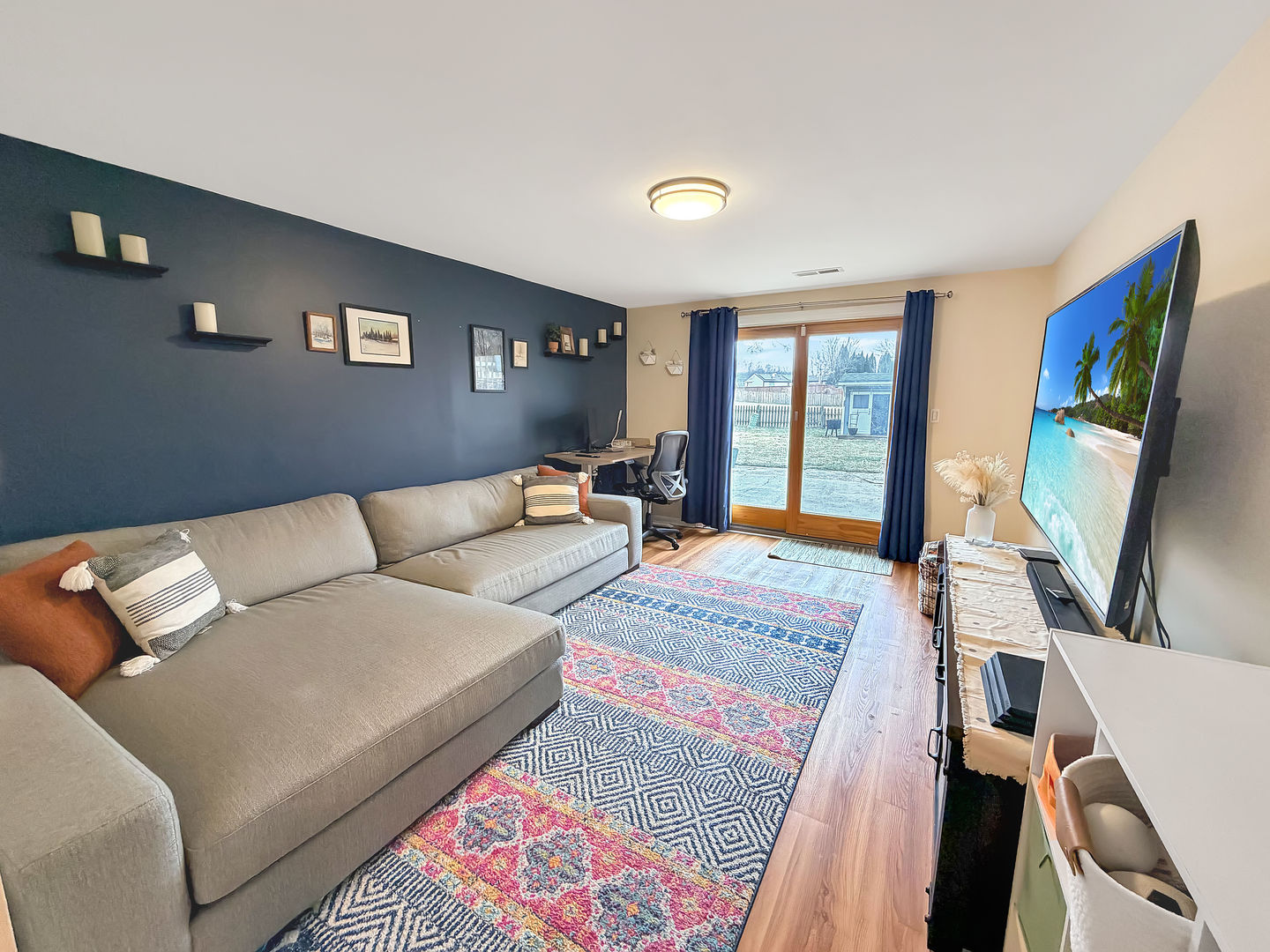 104 McClellan Street Bartlett, IL 60103 - Photo 18 of 21 a living room with furniture and a flat screen tv
