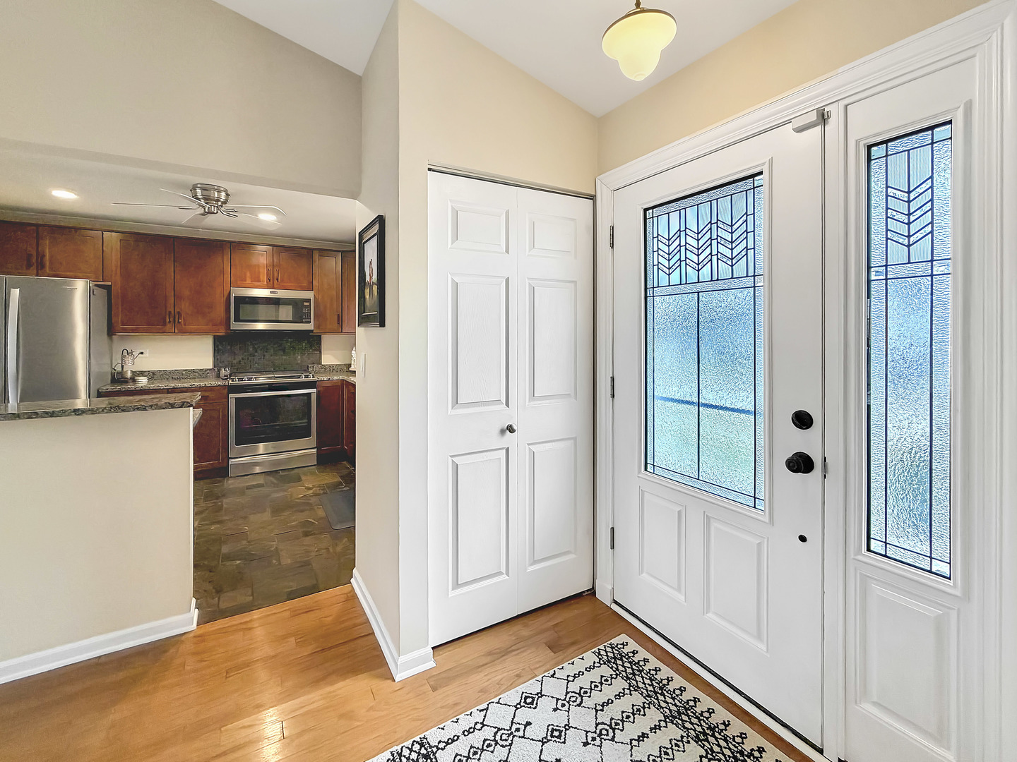 104 McClellan Street Bartlett, IL 60103 - Photo 2 of 21 a view of a kitchen with a refrigerator and microwave