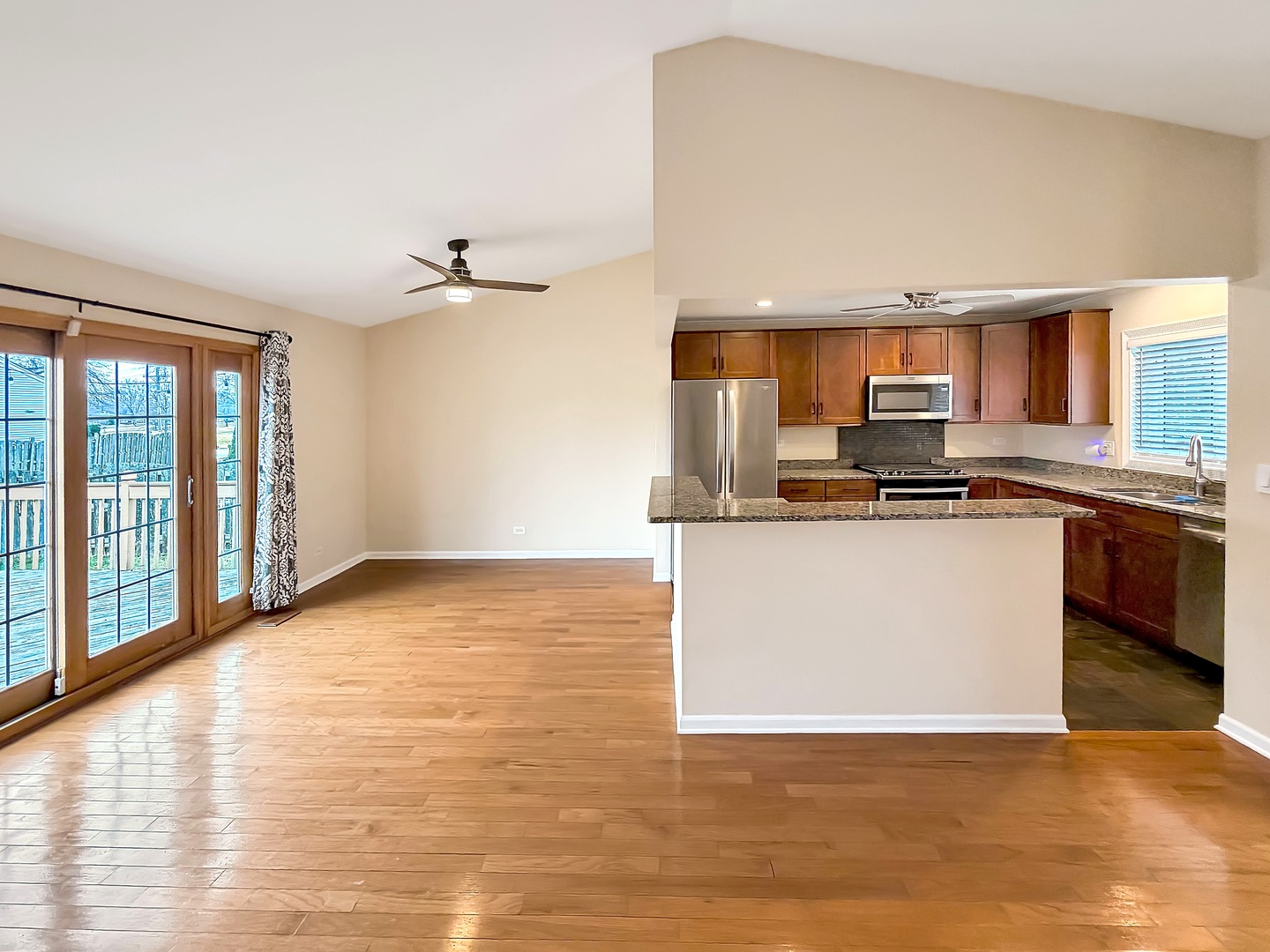 104 McClellan Street Bartlett, IL 60103 - Photo 4 of 21 a view of a kitchen with stainless steel appliances granite countertop a stove top oven a sink and a granite counter top