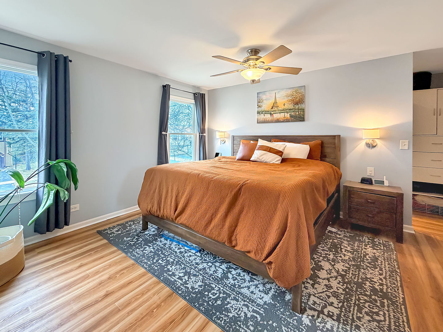 104 McClellan Street Bartlett, IL 60103 - Photo 9 of 21 a bedroom with a bed lamps and wooden floor