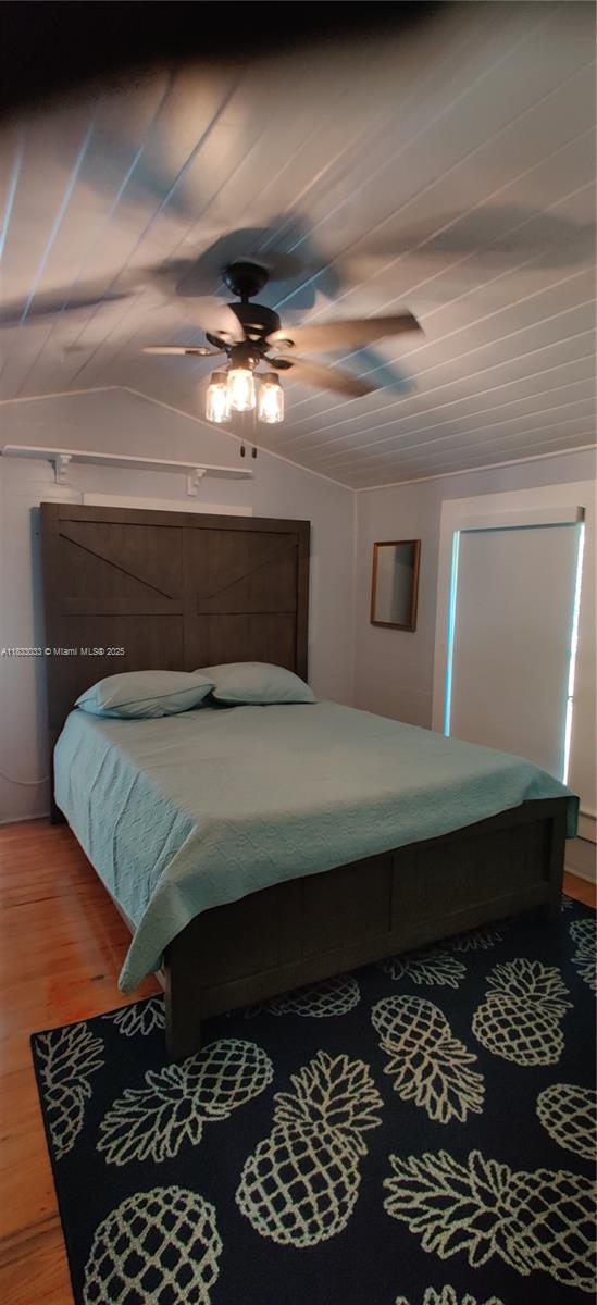 16475 Southwest 248th Street, Unit 16475 Homestead, FL 33031 - Photo 6 of 8 a bedroom with a bed and a window