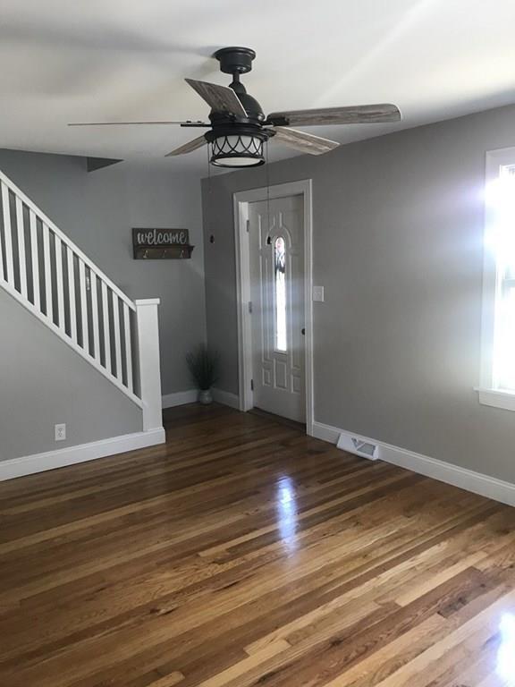 33 Surrey Road Springfield, MA 01118 - Photo 12 of 22 a view of a livingroom with wooden floor and a ceiling fan