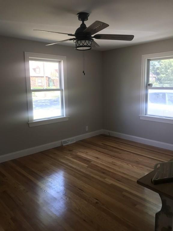 33 Surrey Road Springfield, MA 01118 - Photo 13 of 22 a view of empty room with wooden floor and fan