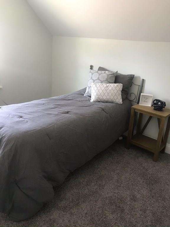 33 Surrey Road Springfield, MA 01118 - Photo 21 of 22 a bed sitting in a bedroom next to a window