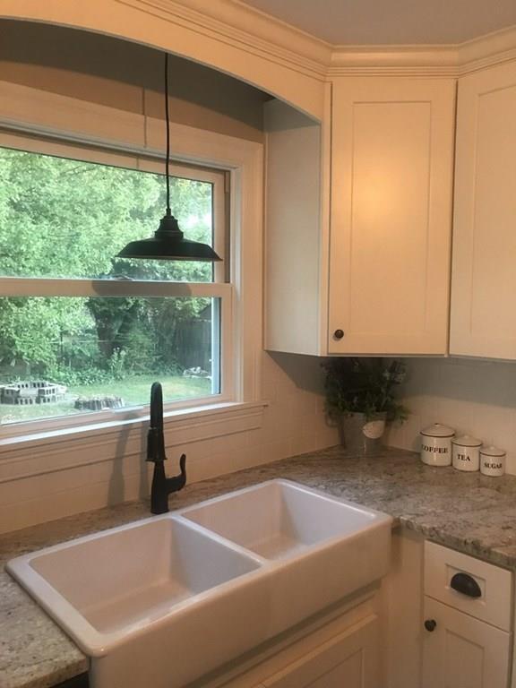 33 Surrey Road Springfield, MA 01118 - Photo 5 of 22 a kitchen with a sink and a window