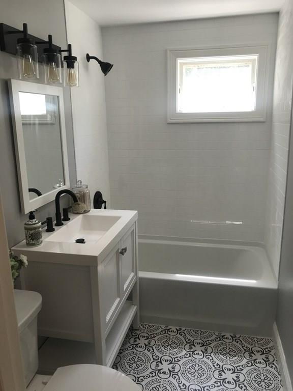 33 Surrey Road Springfield, MA 01118 - Photo 8 of 22 a bathroom with a sink a toilet and shower